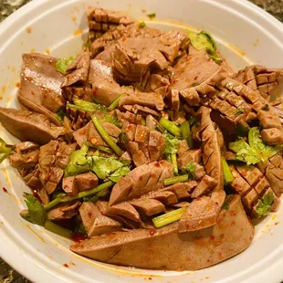 a bowl of beef and broccoli