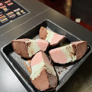 Spumoni bomba (strawberry, pistachio, and chocolate gelato coated in chocolate)