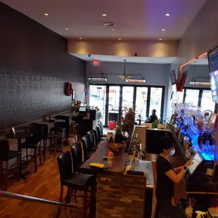 a woman sitting at a bar