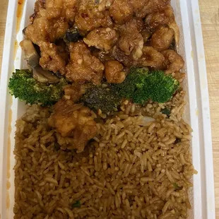 a container of rice, broccoli, and chicken