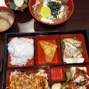 bento box with grilled hamachi, agedashi tofu teriyaki, and chicken teriyaki