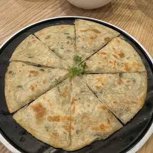 a flatbread pizza on a plate