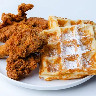a plate of fried chicken and waffles