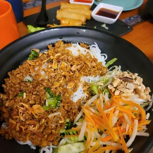 Tork [Tofu, Cauliflower, Lemongrass] Vermicelli with a side of veg crispy spring rolls and sesame balls