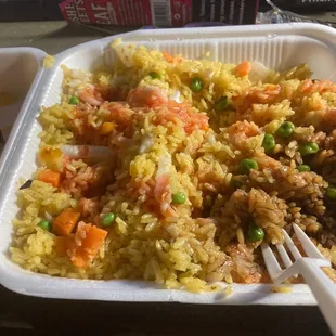 a tray of rice and vegetables