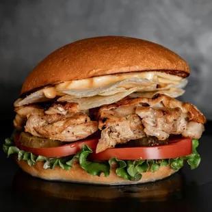 a chicken sandwich with lettuce and tomato