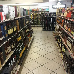 rows of liquor bottles in a store