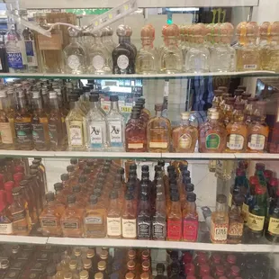 a variety of liquor bottles on shelves