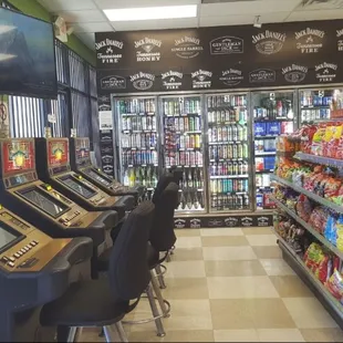 a row of arcade machines in a store