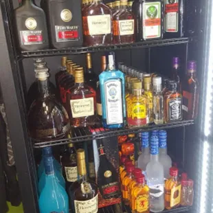 a fridge full of liquor bottles