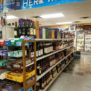 a wide aisle of liquor