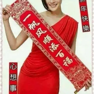 a woman in a red dress holding a chinese scroll