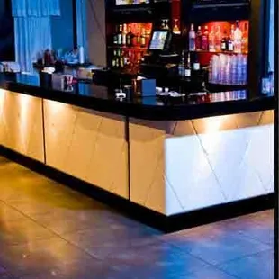 a bar with tvs on the wall