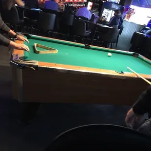 two men playing pool