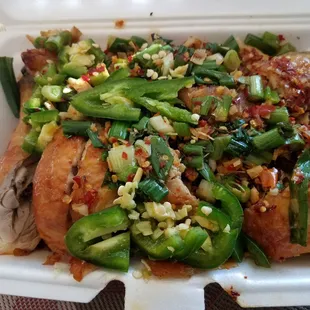 a chicken dish in a styrofoam container