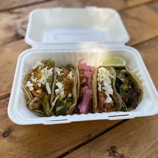 5 tacos combo. From left to right: Brussels, Calabaza, Cochinita, Chicken Tinga, and Encebollado.