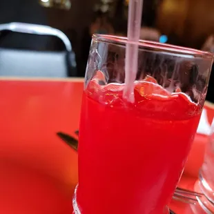 a red drink in a glass