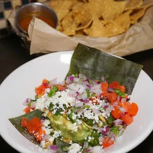 a plate of mexican food with tortillas