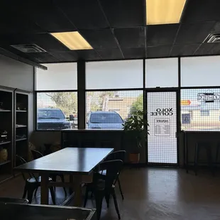 a table and chairs in a coffee shop