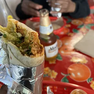 a burrito wrapped in tin foil