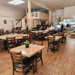 a restaurant with tables and chairs