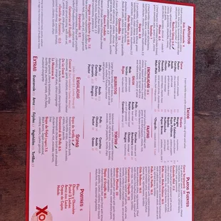 a menu on a wooden table