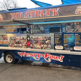 a food truck parked on the side of the road