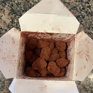 Truffles in takeout box.