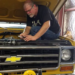 Ken working hard at auto repair