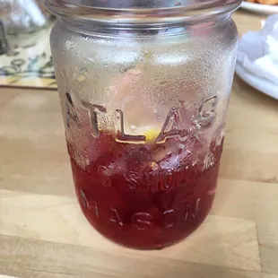 a jar of liquid on a table