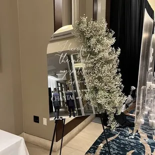 The entrance sign with the single candle