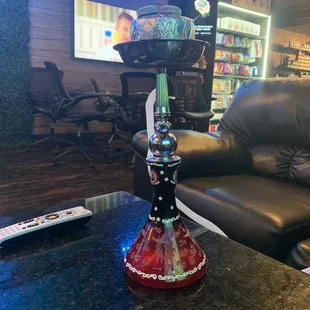 a glass hookah on a table