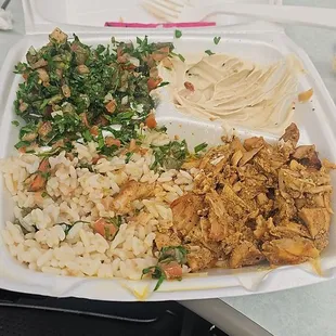 Chicken Shawarma with bland parboiled rice, Tabouleh Oaxaca, and hummus. The hummus and pita saved me. The rest is in the .