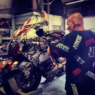 Frank working his magic on my bike, wouldn't trust anyone else to touch her!!