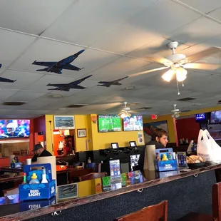 a view of a bar with several laptops