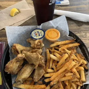 Lemon pepper wings with seasoned fries and tea