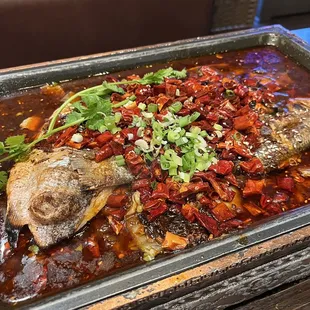 a pan of fish and vegetables