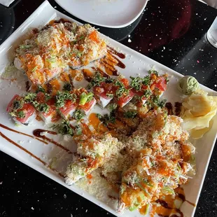Sushi Pizza (6 slices, cut and split on either side of the plate for my friend and I to share), Spicy Tabboulie roll in the middle
