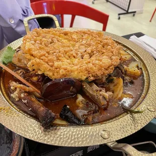 Chengdu Roast Duck Pot topped with Large Fried Eggs