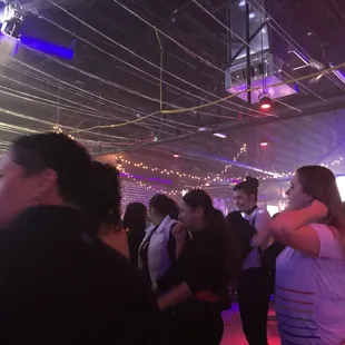 a group of people dancing at a party