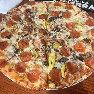 Pizza with most of the toppings