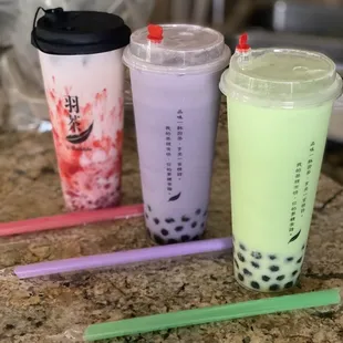 Dirty strawberry milk tea w/ popping lychee, taro boba and honeydew boba