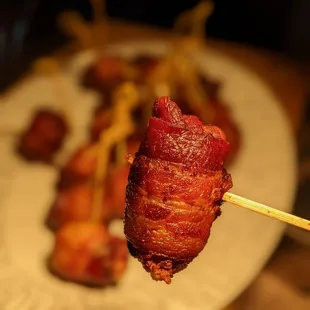 bacon wrapped in bacon on a skewer