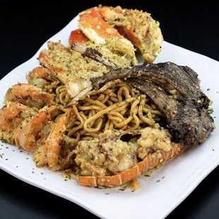 a plate of seafood and noodles