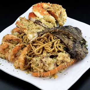 a plate of seafood and noodles
