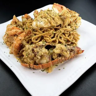 a plate of noodles and shrimp