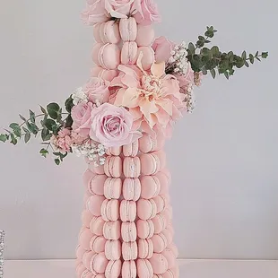 a tall tower of pink macarons