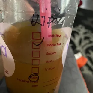 a plastic cup with a pink straw