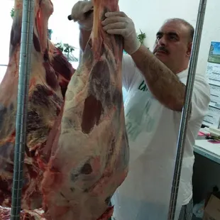 a man holding a piece of meat