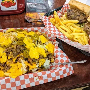 Surf and Turf Loaded Fries on left and Hamburger Po'Boy on right
